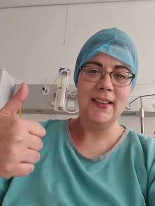 Breast cancer fighter Anita gives a thumbs up from one of her treatment appointments.